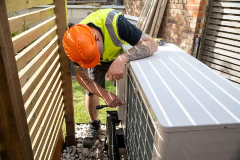 Technician  fixing the Air conditioning unit